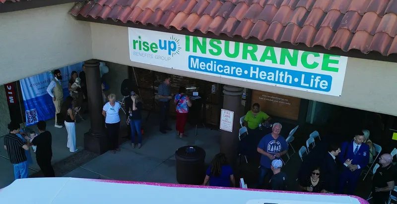 Neighbors and clients at the Rise Up office grand opening